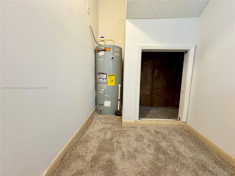 Extra storage closet off of downstairs bathroom.