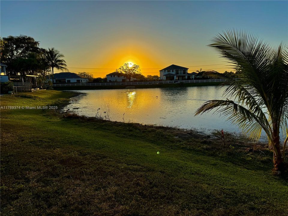 End your day with this gorgeous sunset view from you own screened in patio!