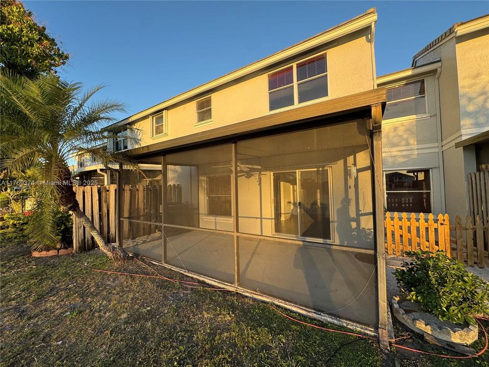 Large screened in patio on lake for relaxing at the end of the day.