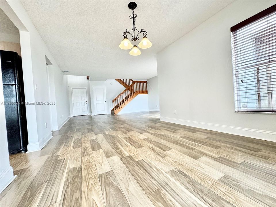 View from the dining into the living room of the front entrance.