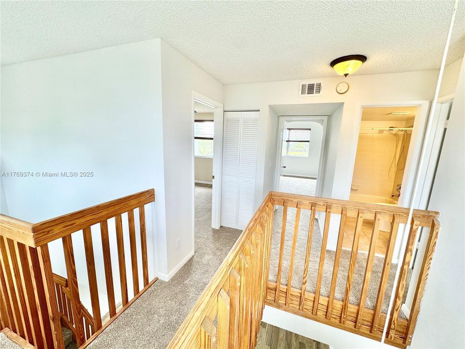 Stairway to the 3 upstairs bedrooms and bathroom.