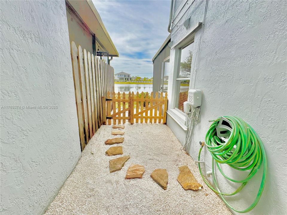 Cute little fenced in space to allow your small dog some outdoor time or to create a cute garden space.