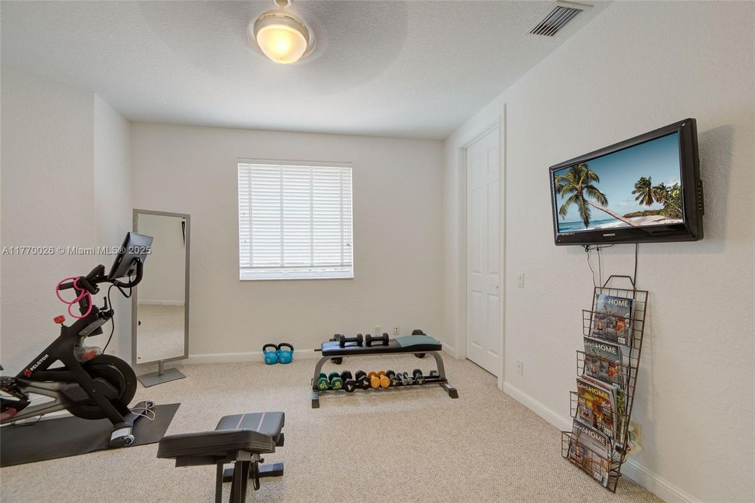 Bedroom 5 currently set up as a home gym