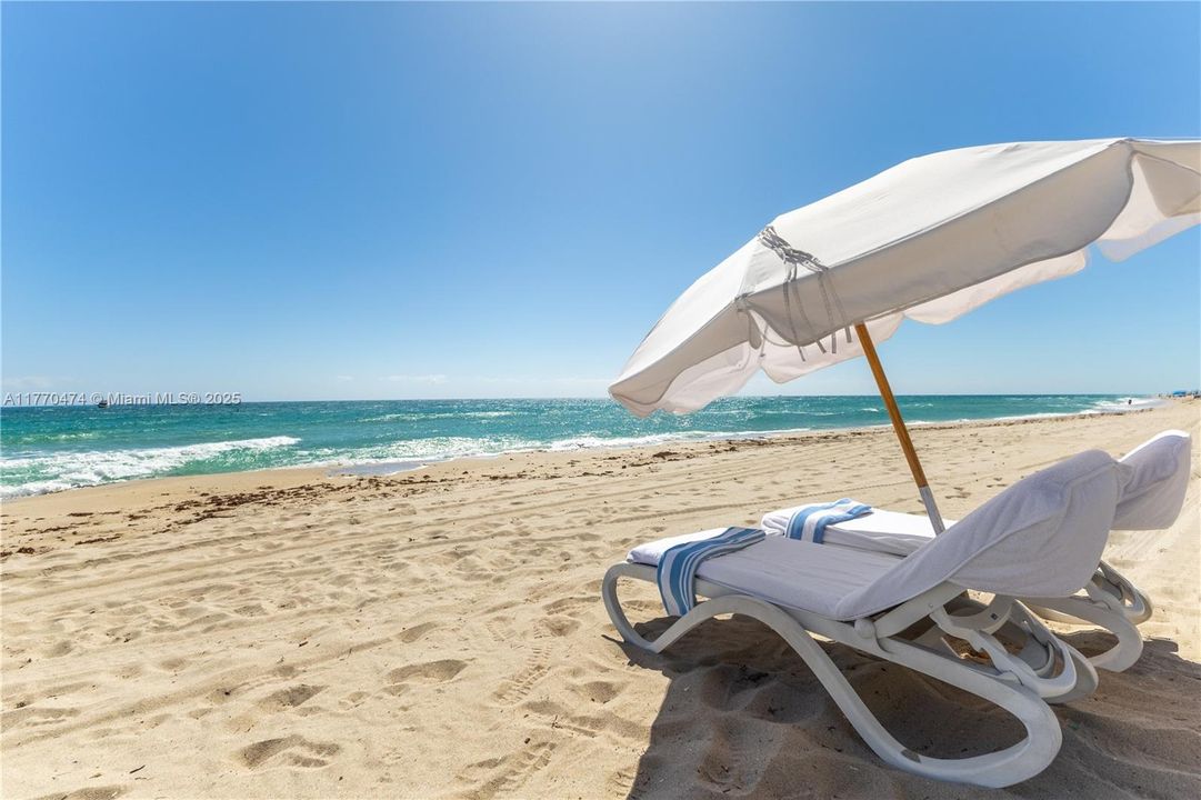 Relax w/ beach towel & umbrella service