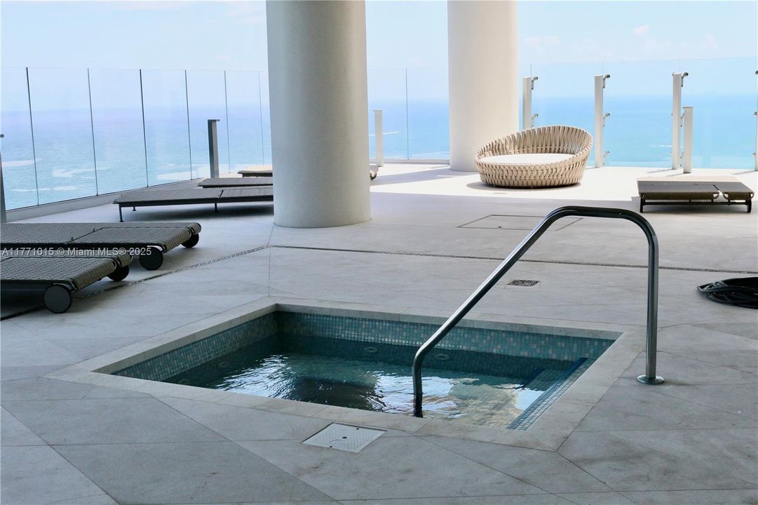 Common area with terrance and jacuzzi