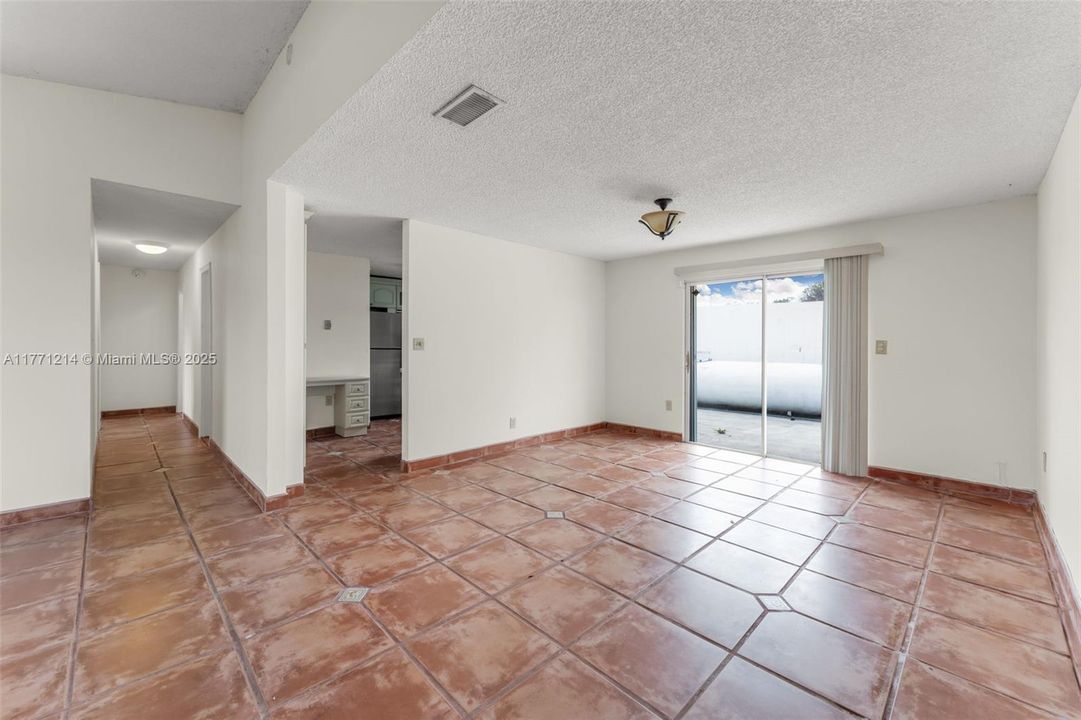 OPENS TO THE KITCHEN. THATS THE 1000lb PROPANE TANK OFF PATIO IT CAN BE BURIED.