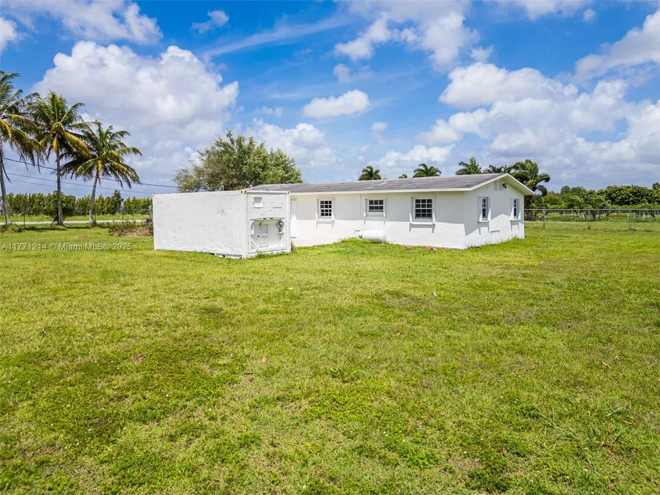 LARGE INSULATED AIR-CONDITIONED CONTAINER IS LOCATED OFF THE PATIO. YOU CAN EASILY RELOCATE ELSEWHER ON THE PROPERTY FOR A BETTER PLACEMENT.