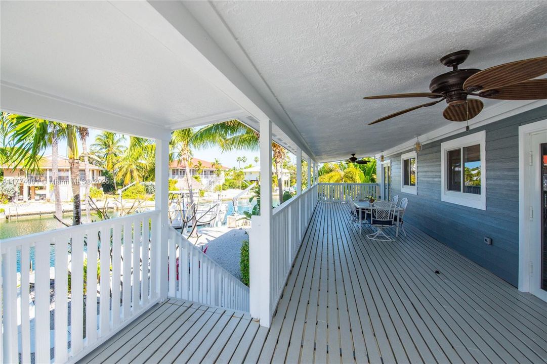 Large covered deck off living room with views