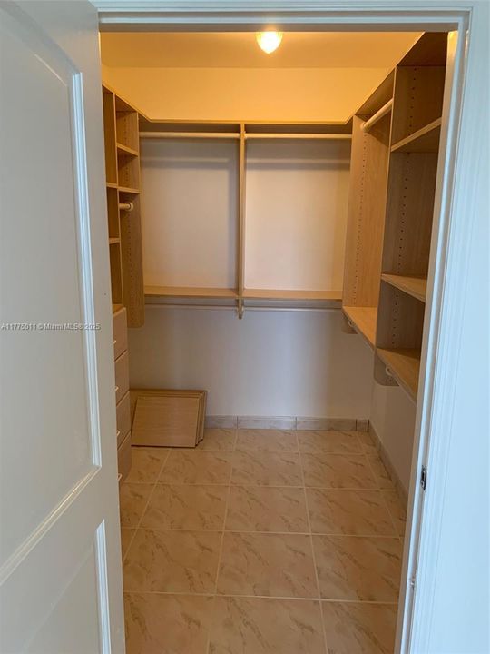 master room with his and hers walking closet