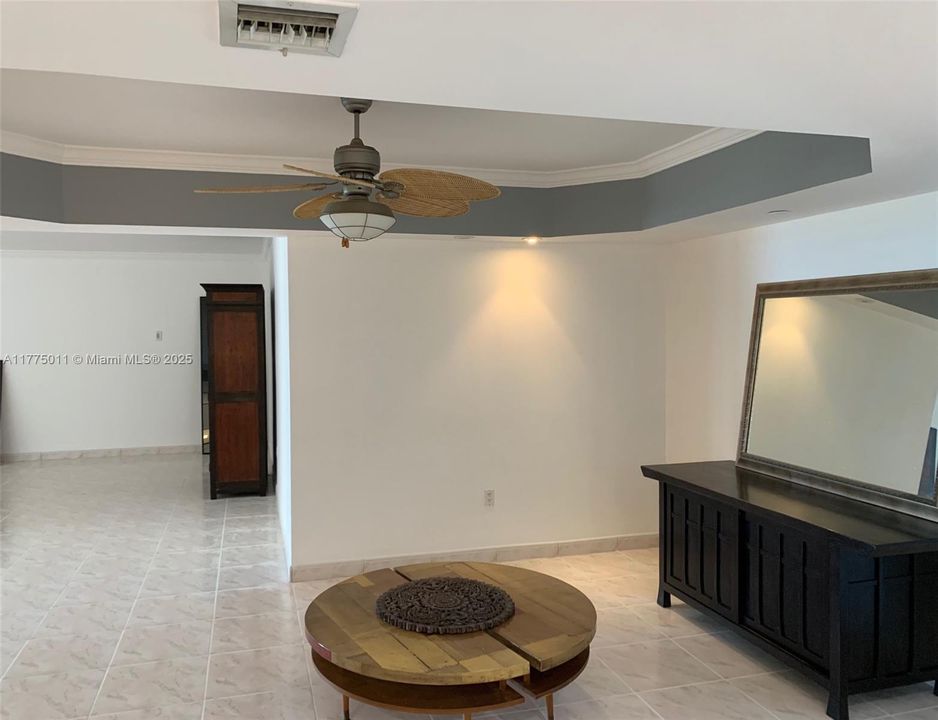 Large Living area with sliding doors to the balcony