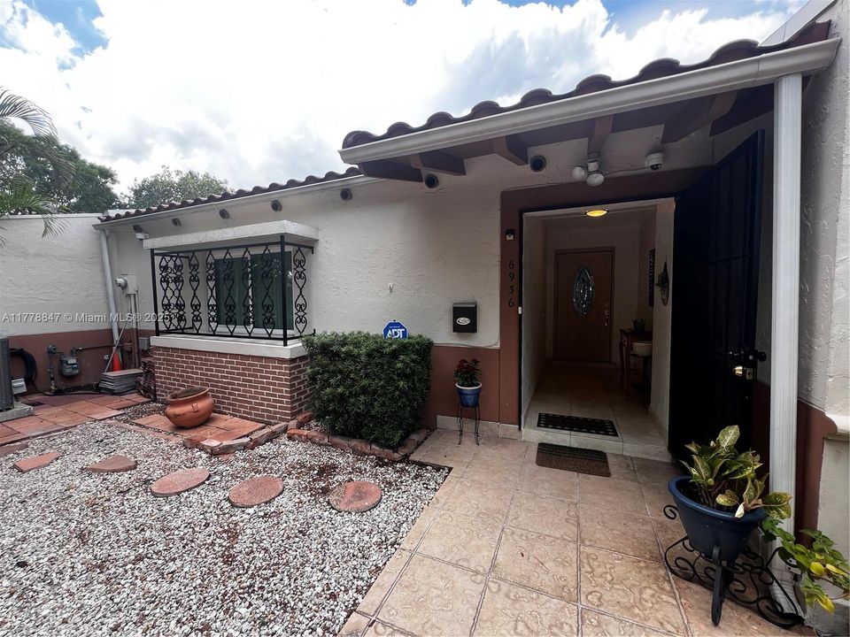 Charming courtyard entry welcomes you home.