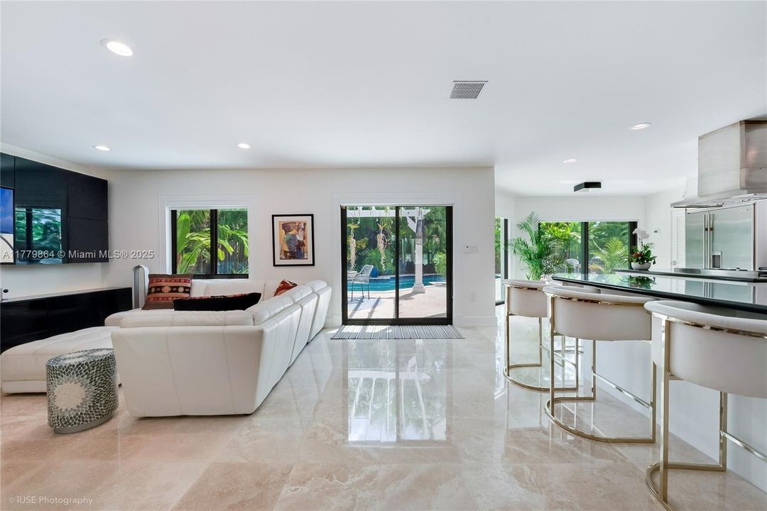 View to the Exterior from Living Room to Family Room and Kitchen