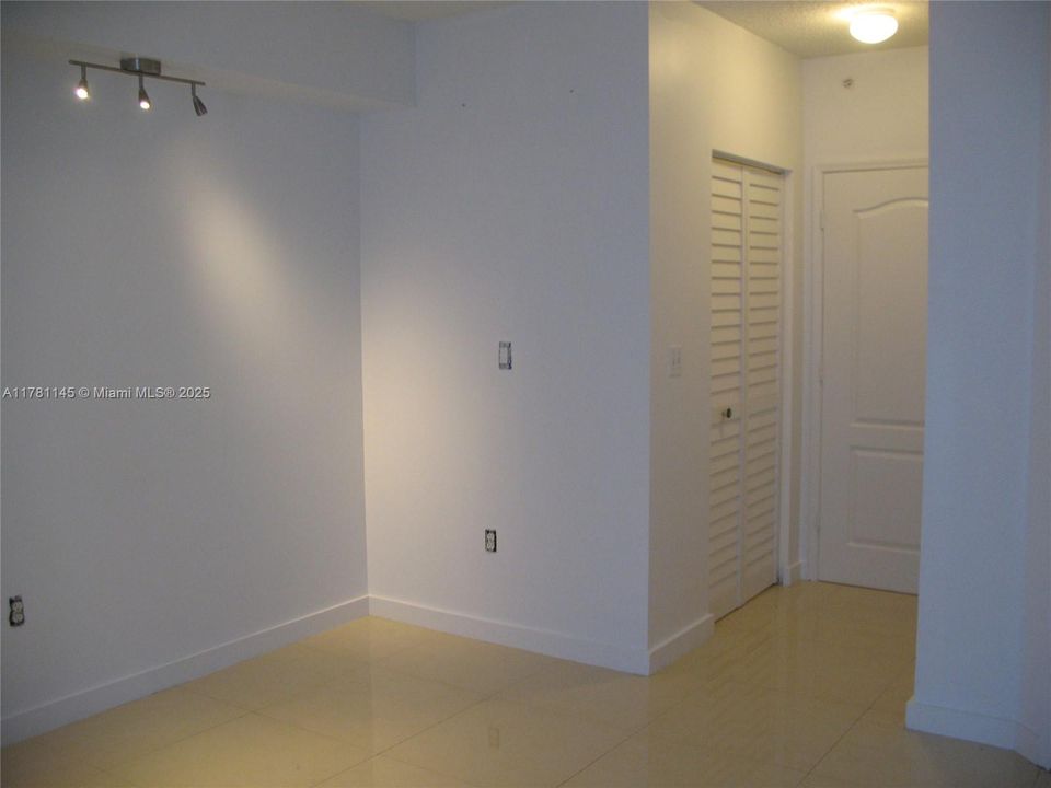 Bedroom with entry to bathroom and 2 closets