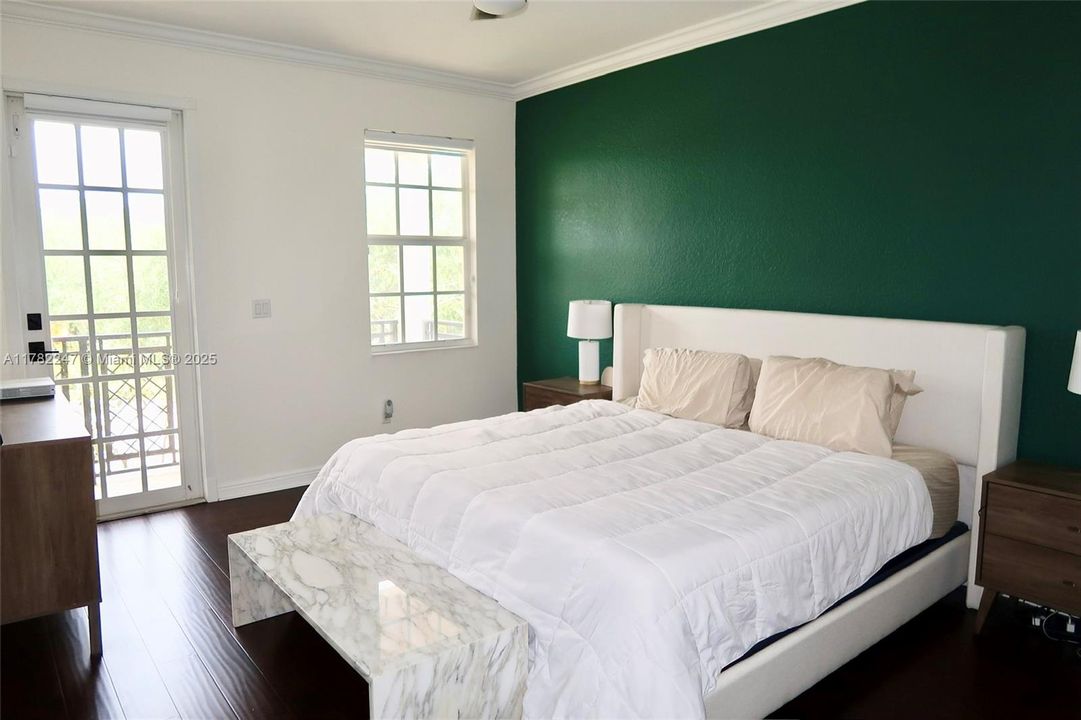 Primary bedroom w/ large balcony