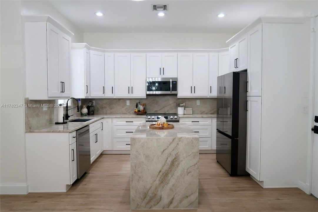 Brand new updated kitchen. Island has room for seating.