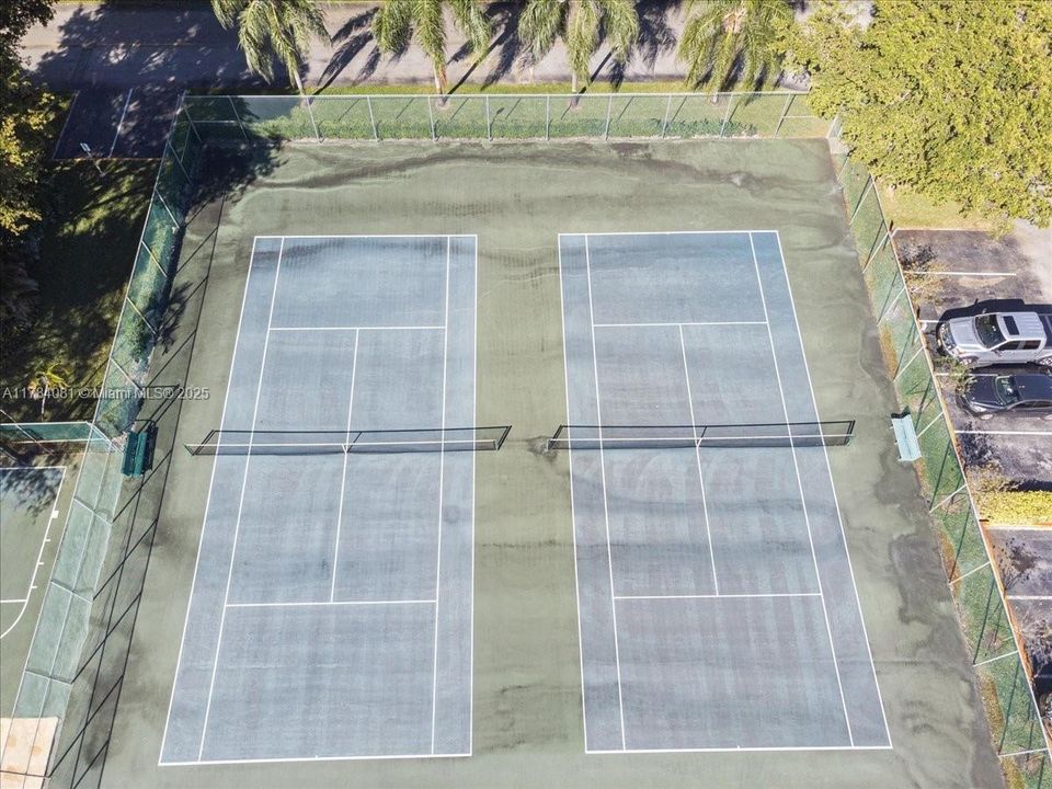 one tennis court was converted into two Pickleball courts