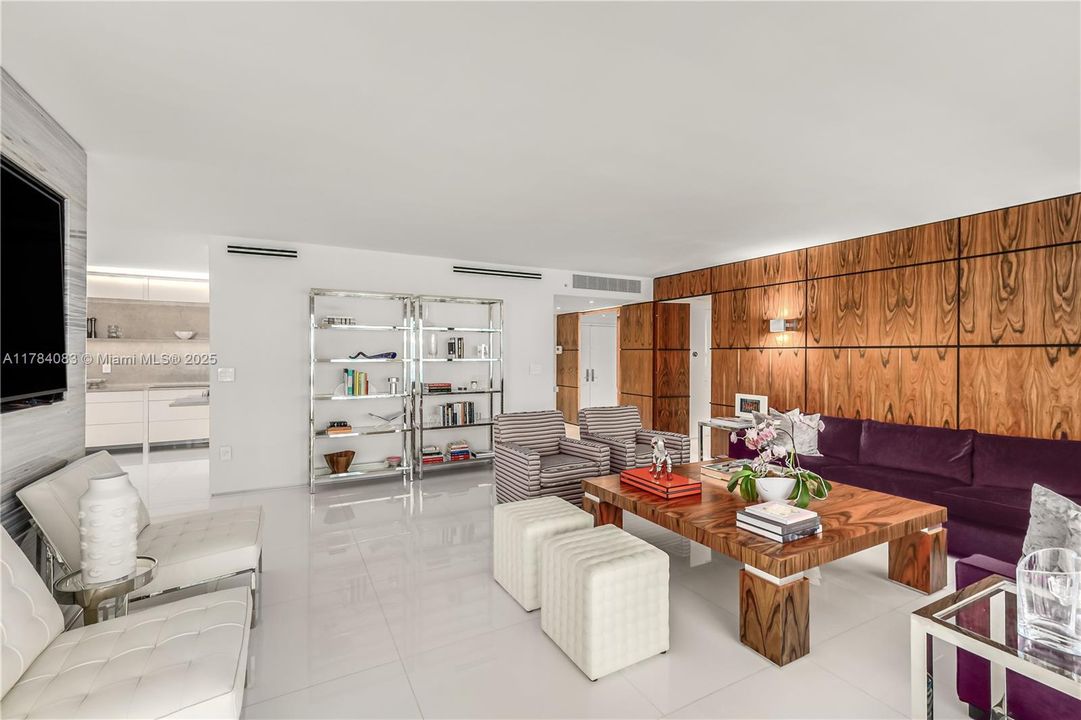 Expansive living room with open dining room and separate den area.