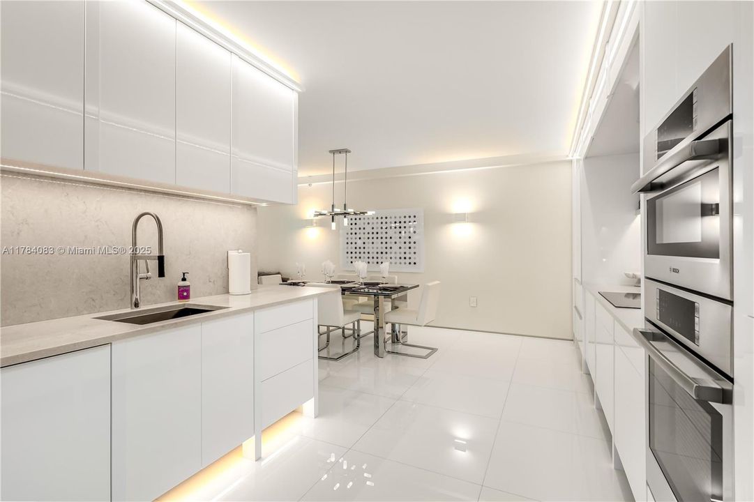 custom lighting creates a beautiful kitchen ambiance.