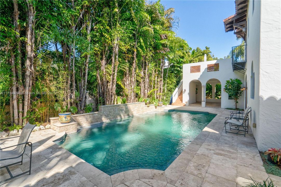 All tiled pool and travertine patio