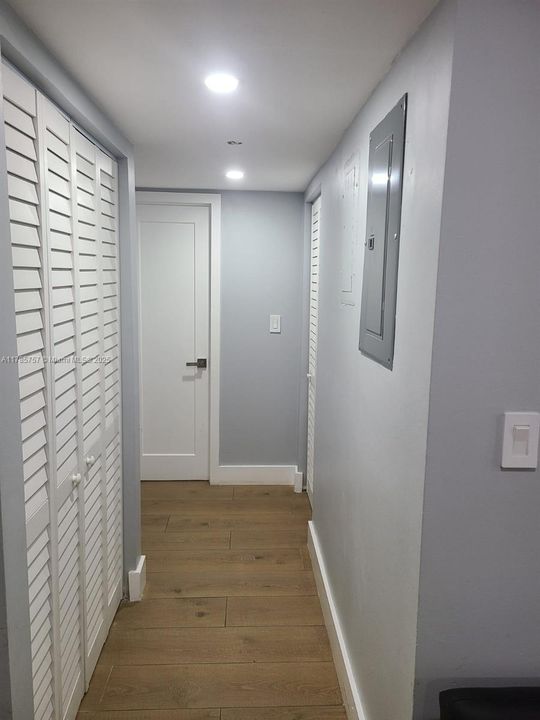 Hallway leading to one of the bedrooms and washer/dryer closet.