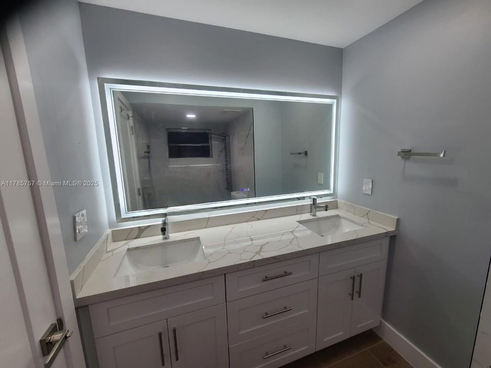 Master bathroom with dual sinks.
