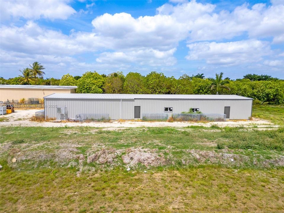 BLDG #1 NEW METAL 2025 INSULATED WAREHOUSE W 2 ROLL DOWN DOORS, 2 WALK IN DOORS, IMPACT WINDOWS, SEPARATE METER, BUILDING SIZE IS 4,320 SQ.FT. SIZE IS 36X120 3 PHASE