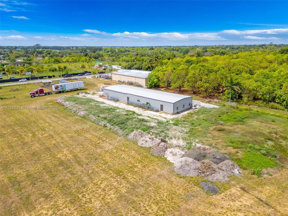 NEW METAL OFFICE BUILDING #1 IS 36X120 3 PHASE PLUMMED W/ 2 ROLL DOWN DOORS AND 2 WALK IN ENTRYS, IMPACT WINDOWS..