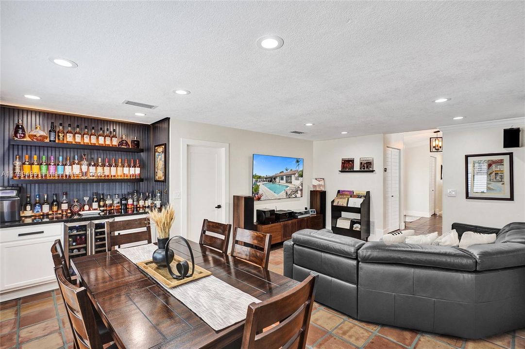 2nd dining area by the family room with a bar