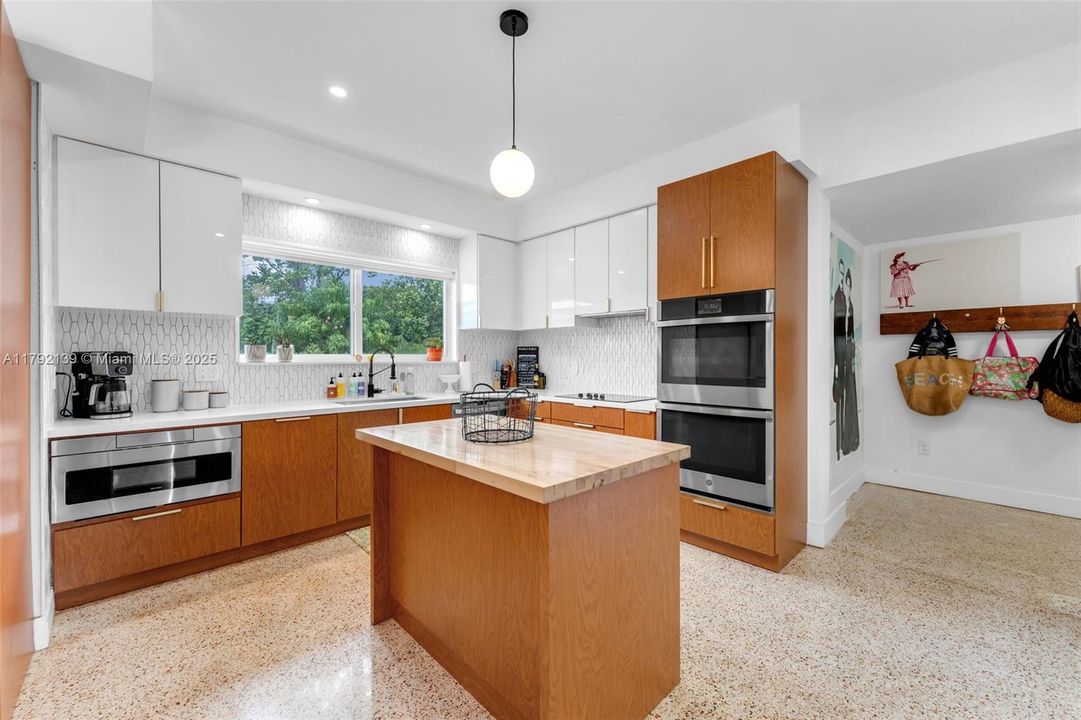 ANOTHER VIEW OPENS INTO PANTRY AND LAUNDRY ROOM.