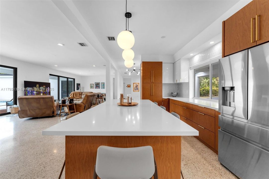 UNSEEN TO LEFT IS FORMAL DINING ROOM OFF KITCHEN.