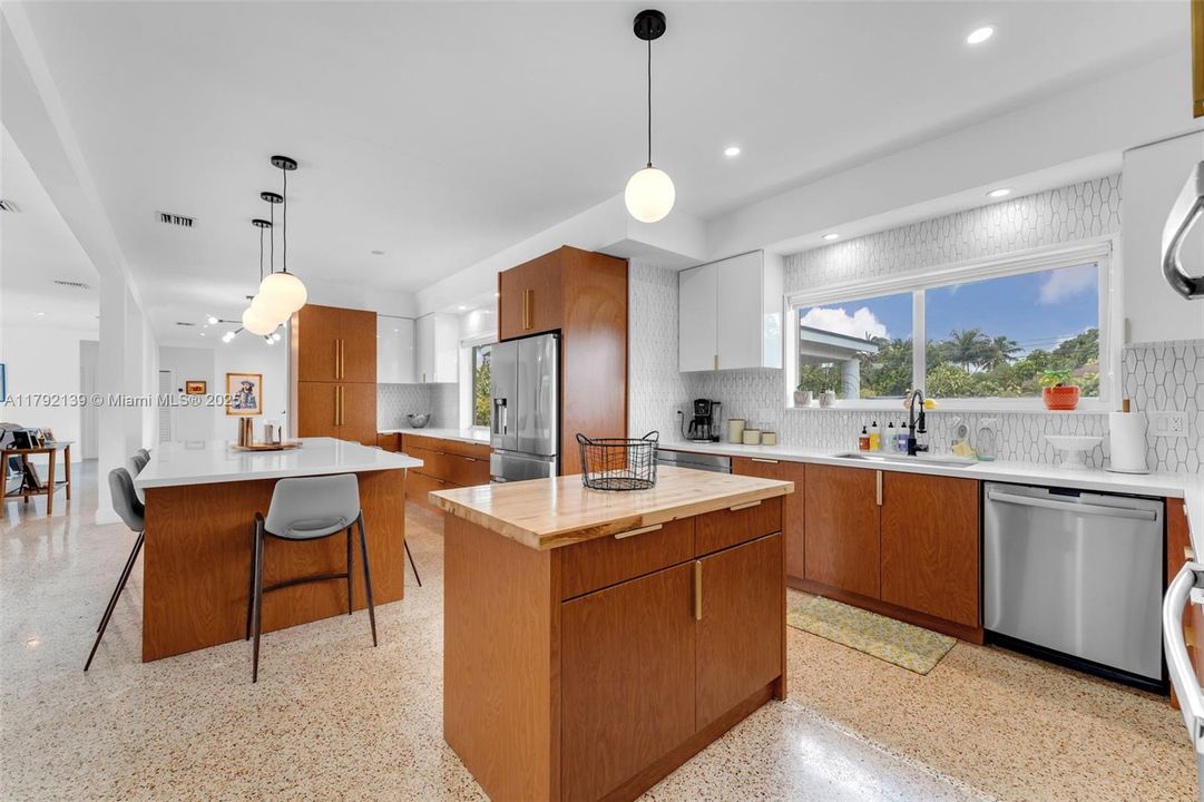 / CUSTOM CABINETS, EATING ISLAND, SECOND ISLAND FOR FOOD PREP, FARM SINKS, WALL OVENS, & COUNTER BAR W/ BUILT INS