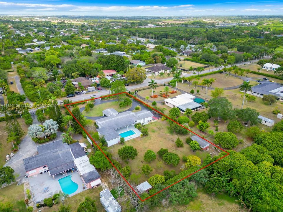 LOOKING WEST HOME FACES ROBERTS ROAD AKA SW 182 AVE,,