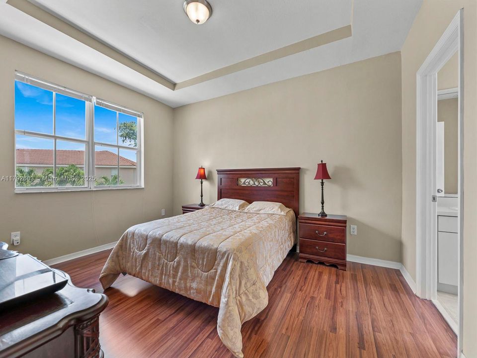 Primary bedroom with pool view