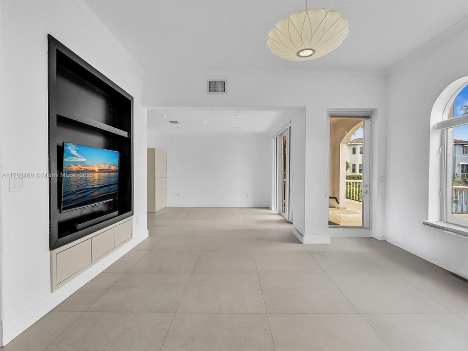 Volume ceilings create the best look in this beautiful great room offering views of the gorgeous lake from each vantage point.