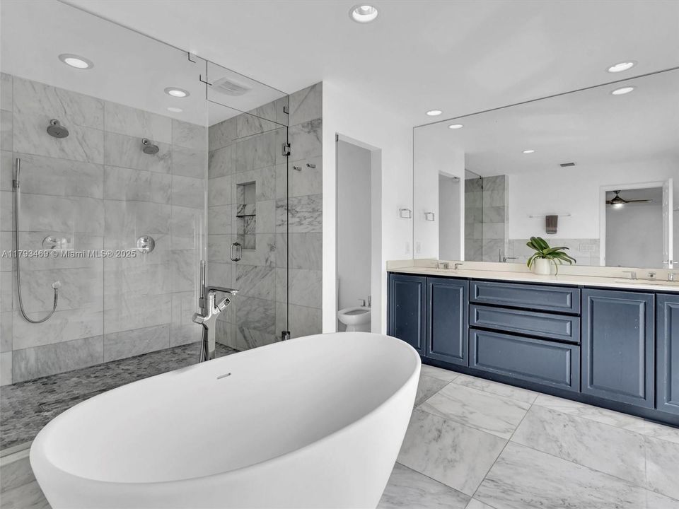 Talk about spa like bath! The double full steam shower is a dream come true! Well designed with private water closet, double sinks, and a fabulous stand alone tub! This bathroom also has a private balcony overlooking the lake! What more could you want!