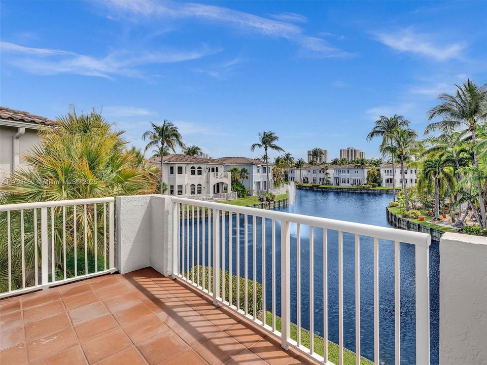 Enter this second floor private balcony from the primary bedroom or the spa like bath...