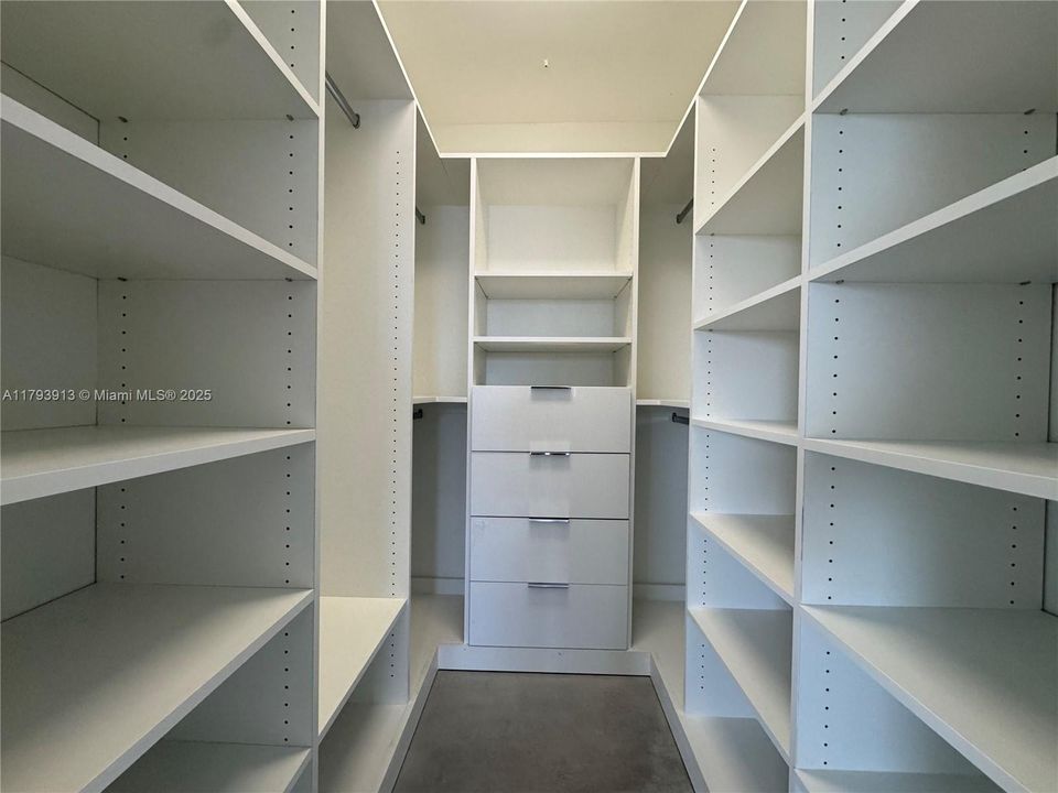 Walk-in closet in primary bedroom