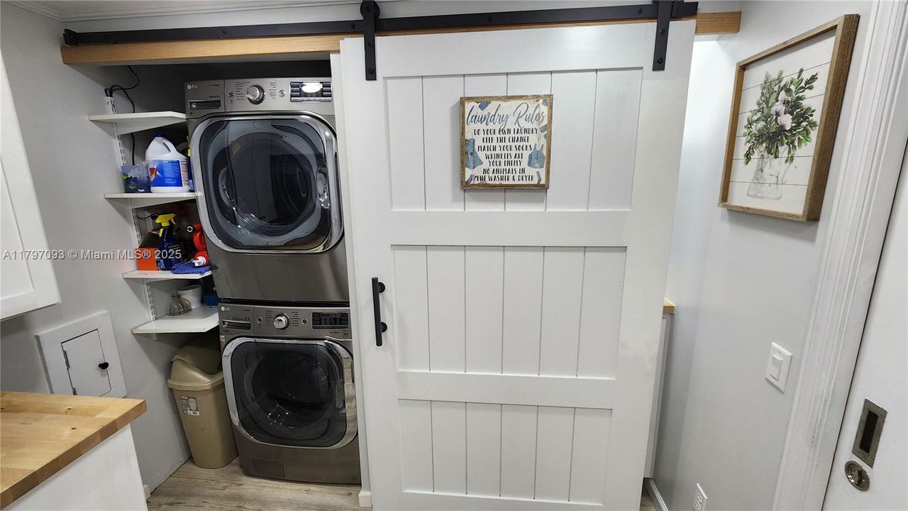 Washer/dryer behind barn door