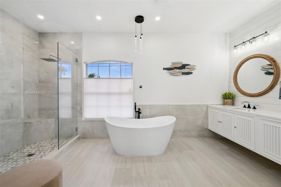 Primary Bath with Glass wall shower and soaking tub