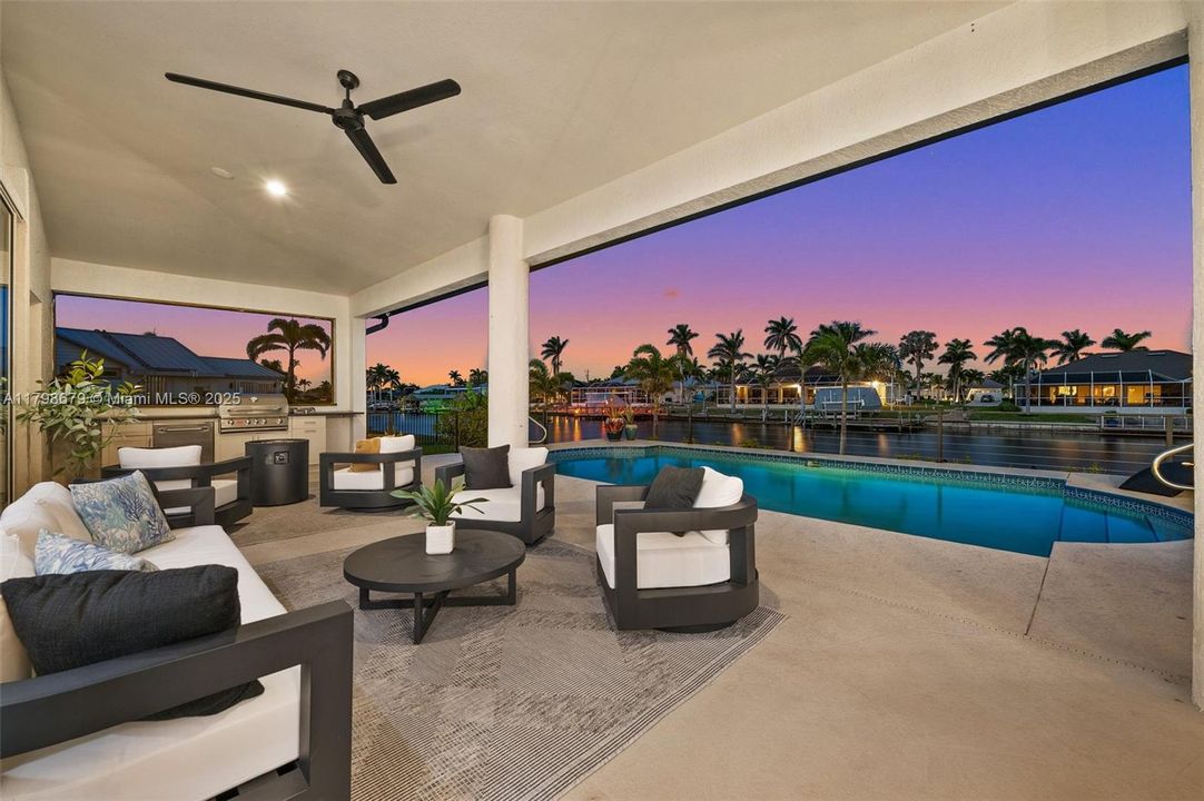 Large Covered Lanai and Outdoor Kitchen in the Evening