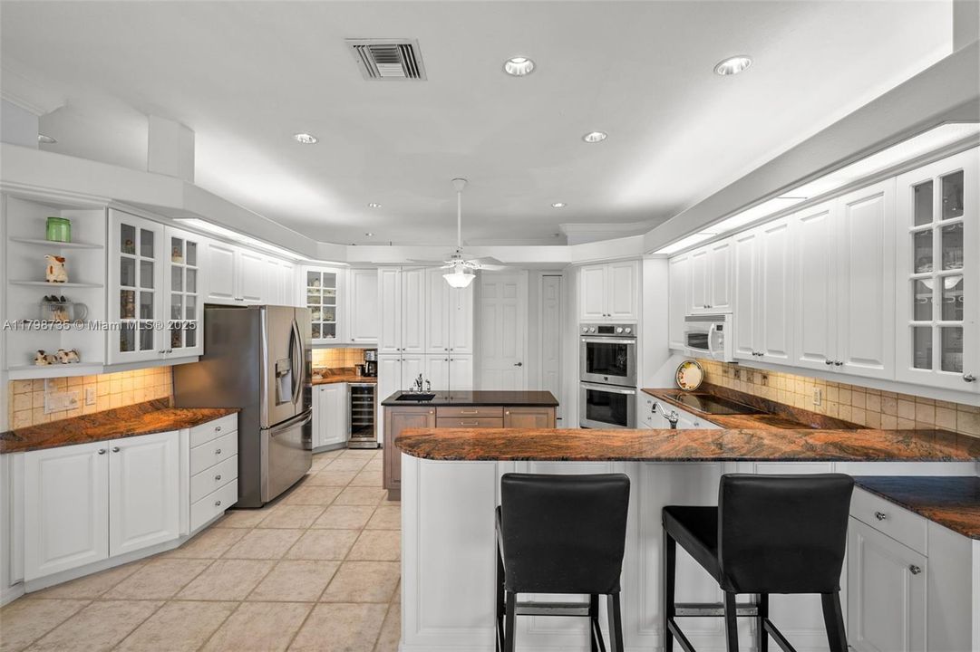 Breakfast bar and lots of cabinets