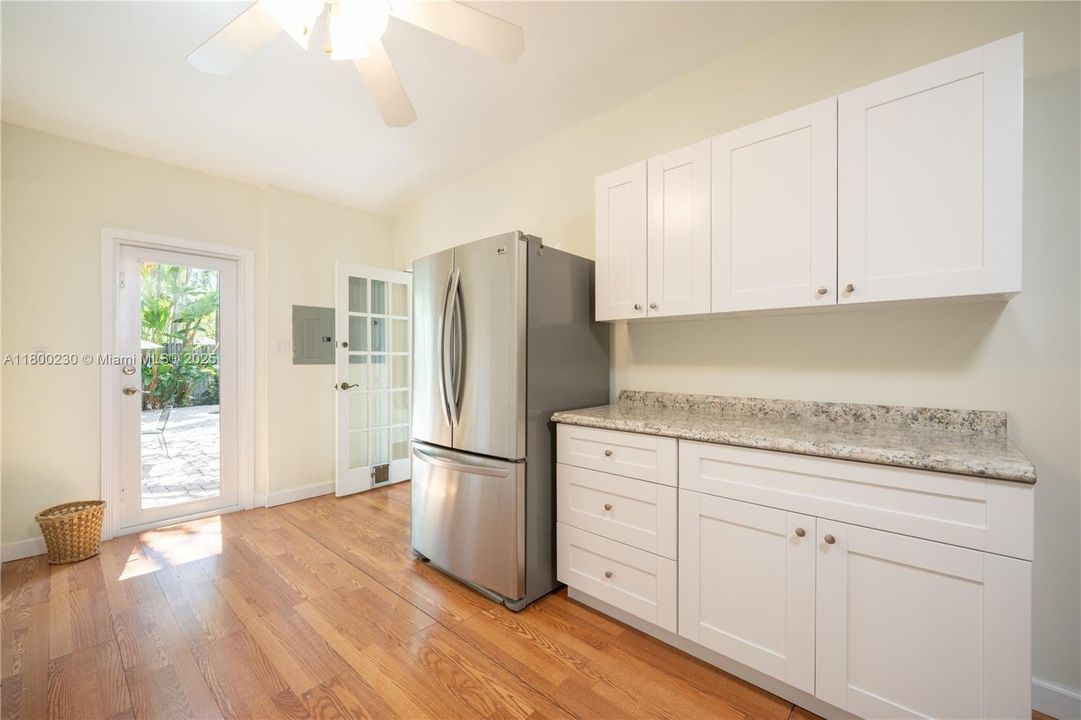 Large Laundry with cabinetry and closet area