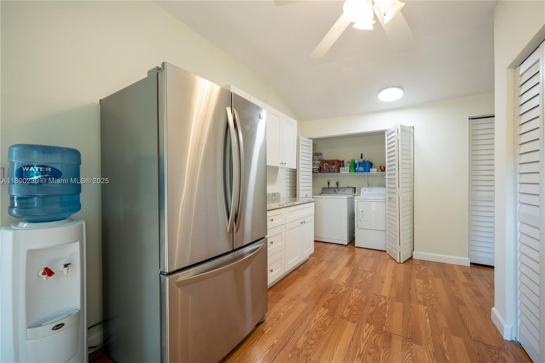 Very spacious laundry room with lots of closet space and cabinetry
