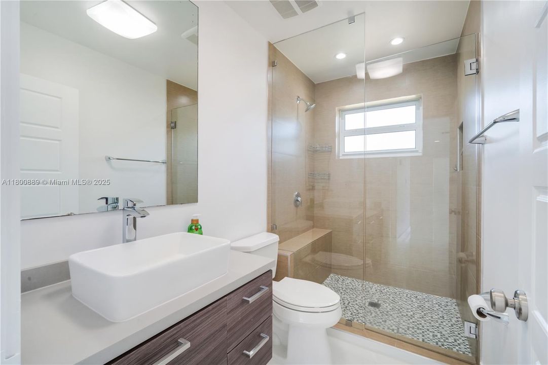 Updated bathroom serves both bedrooms