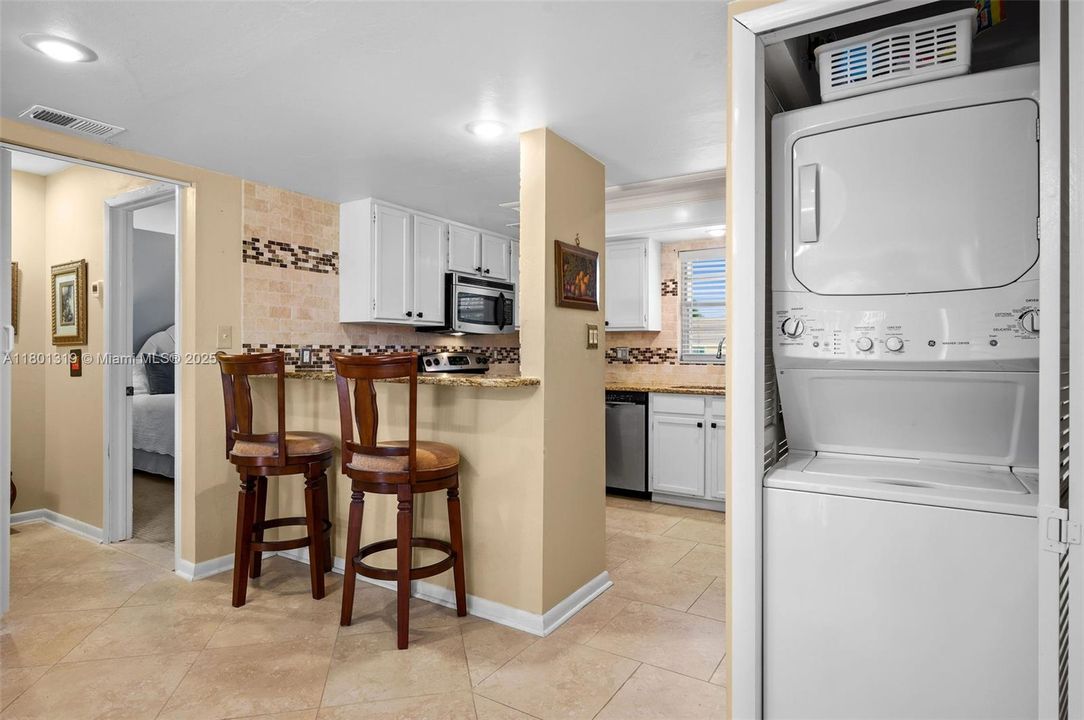 Washer and Dryer tucked away in a closet.