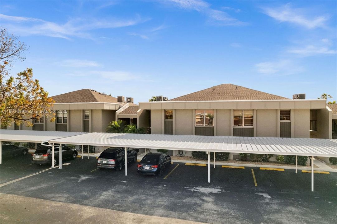 The front of the condo and parking