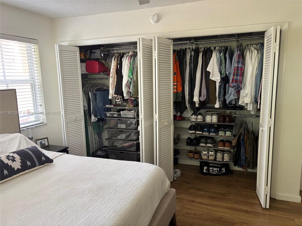 Primary closet with custom closets