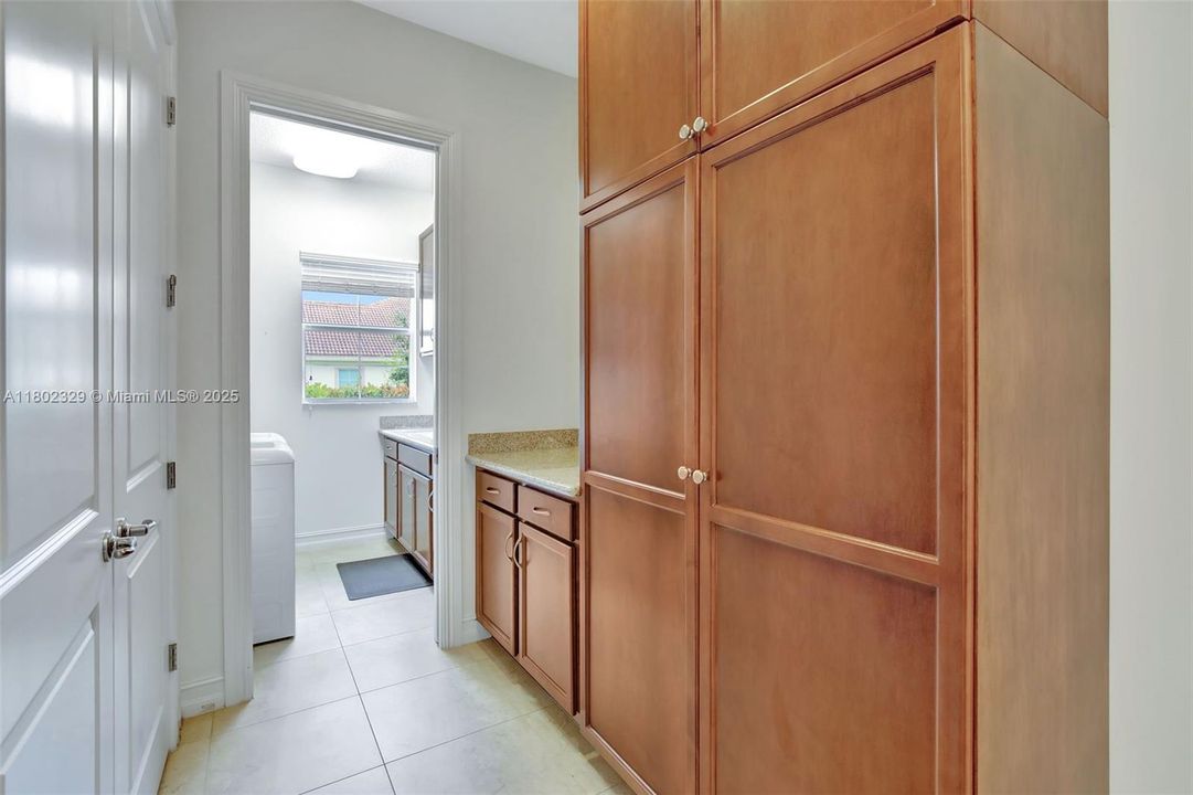 Hallway/Mudroom/cabinetry leading to laundry room