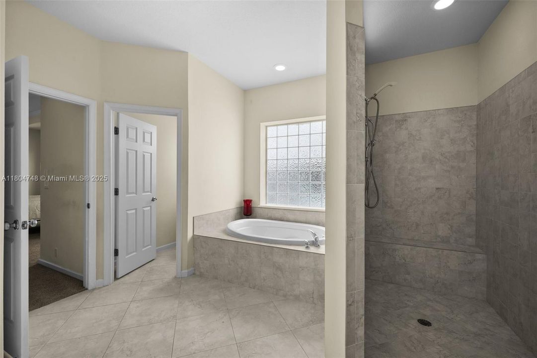Primary Bath with Tiled Shower and separate Soaking Tub
