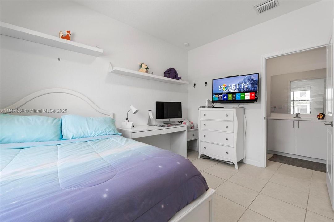 Main-level bedroom: ideal for guests, office, or versatile living space.